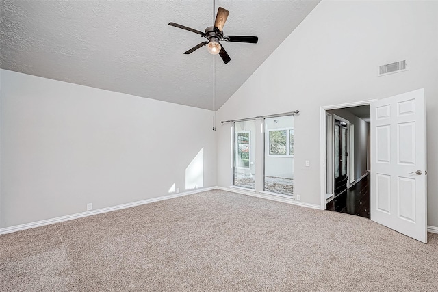 interior space with ceiling fan, carpet, a textured ceiling, and high vaulted ceiling