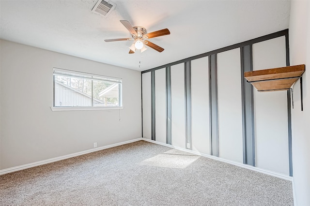 unfurnished bedroom with ceiling fan and carpet floors