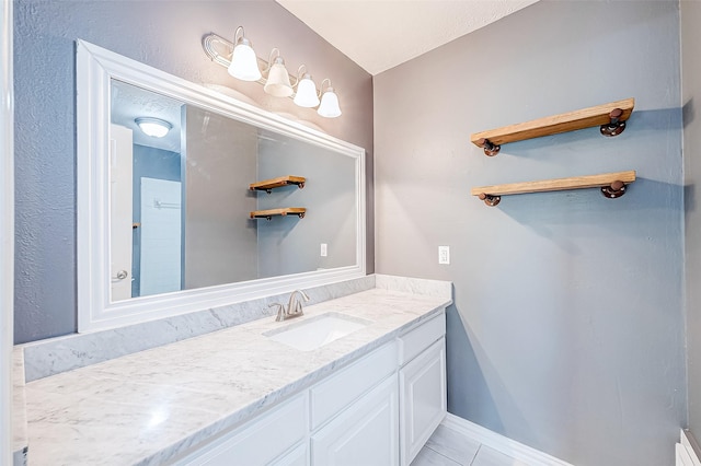 bathroom with tile patterned floors and vanity