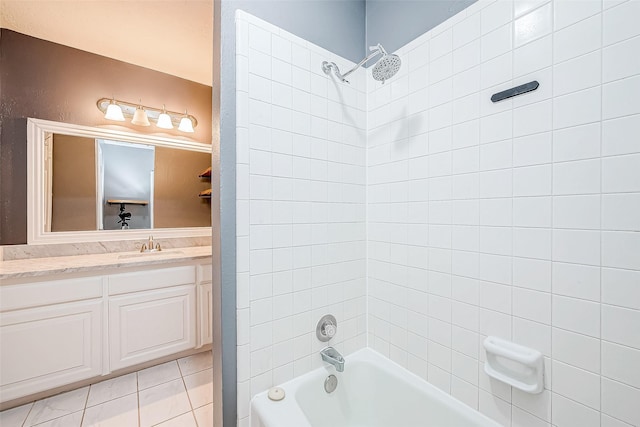 bathroom featuring tile patterned floors, vanity, and tiled shower / bath combo