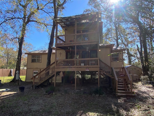 rear view of property featuring a deck