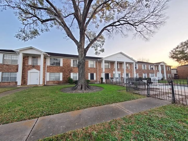 view of front of house with a lawn