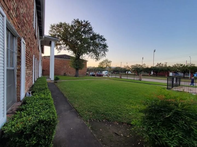 view of yard at dusk