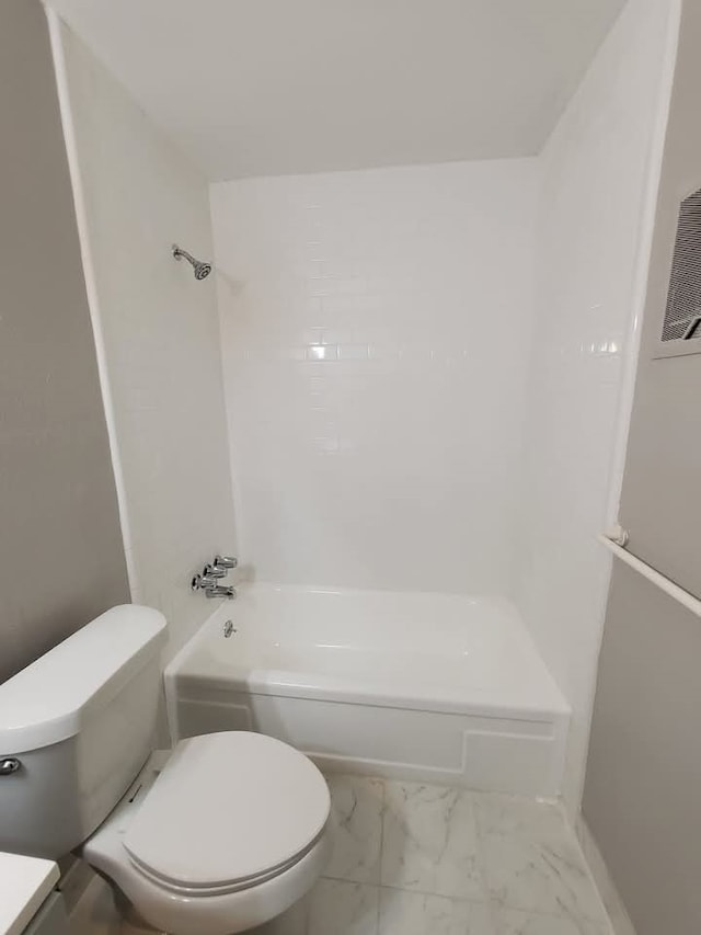 bathroom with bathing tub / shower combination and toilet