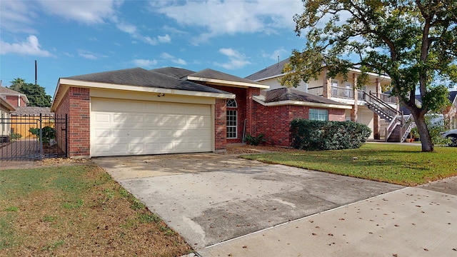 view of front of property with a garage and a front lawn