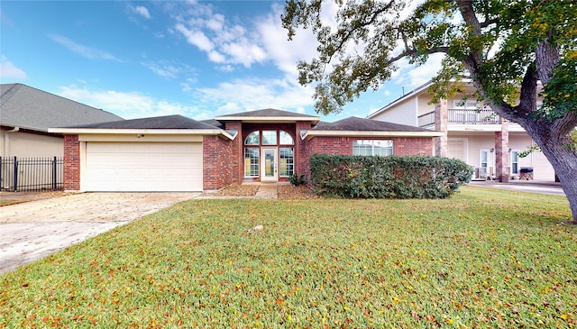 view of front of house featuring a front yard and a garage