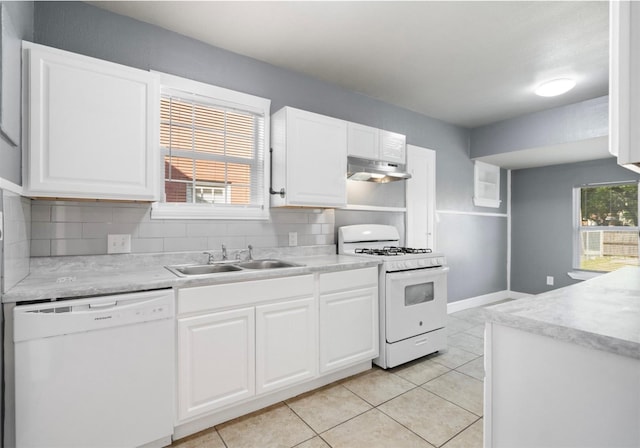 kitchen with sink, white cabinets, white appliances, decorative backsplash, and light tile patterned floors