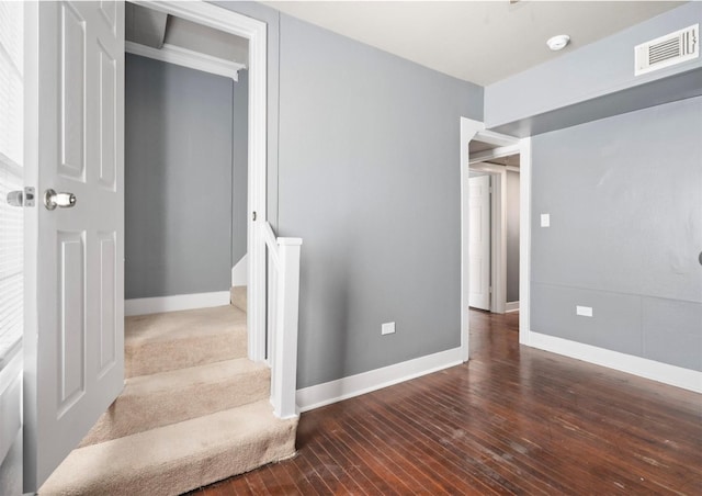 staircase featuring hardwood / wood-style flooring