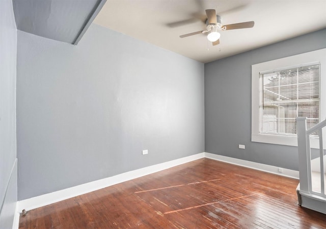 empty room featuring wood-type flooring and ceiling fan