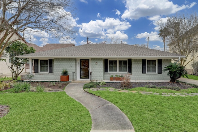 ranch-style home with a front lawn