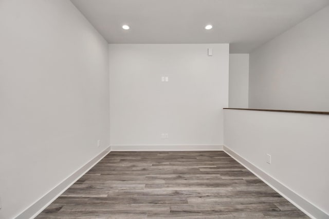 unfurnished room with hardwood / wood-style flooring