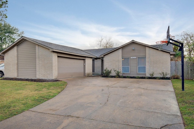 ranch-style house with a front yard and a garage