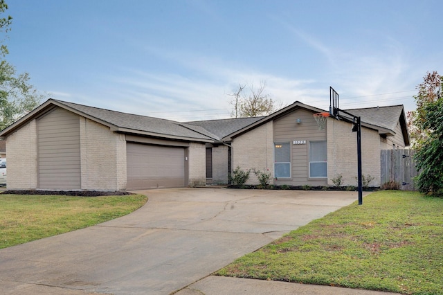 ranch-style house featuring a front yard and a garage