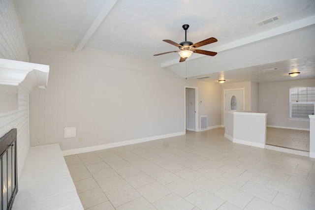 unfurnished living room with a fireplace, light tile patterned floors, vaulted ceiling with beams, and ceiling fan