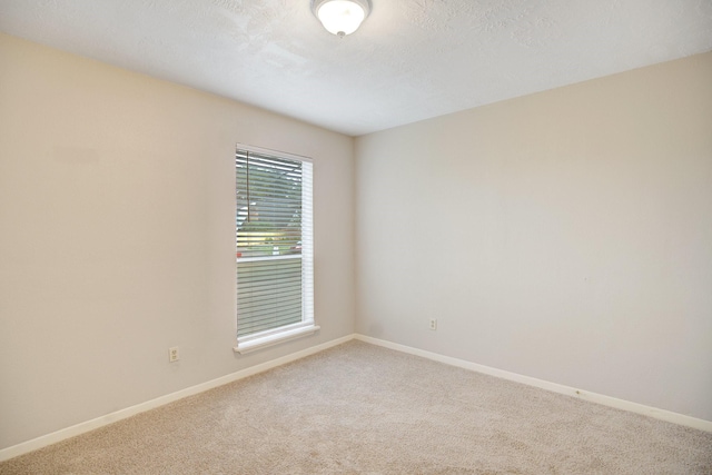 empty room with carpet flooring