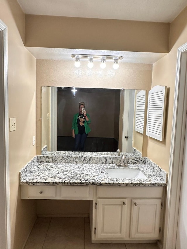 bathroom featuring vanity and tile patterned floors