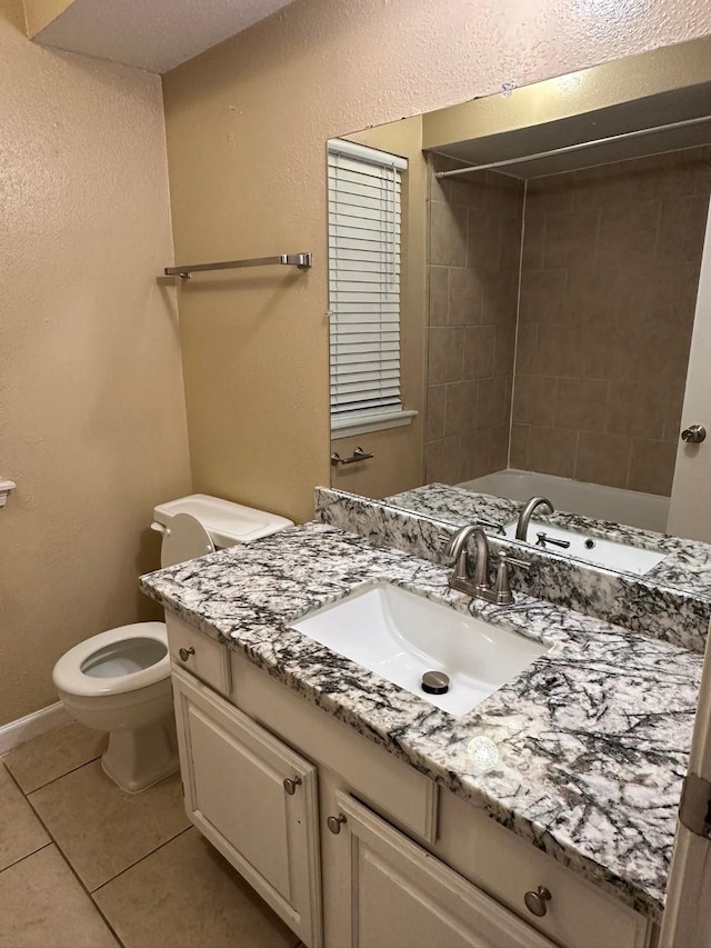 full bathroom featuring tile patterned floors, shower / bathing tub combination, vanity, and toilet