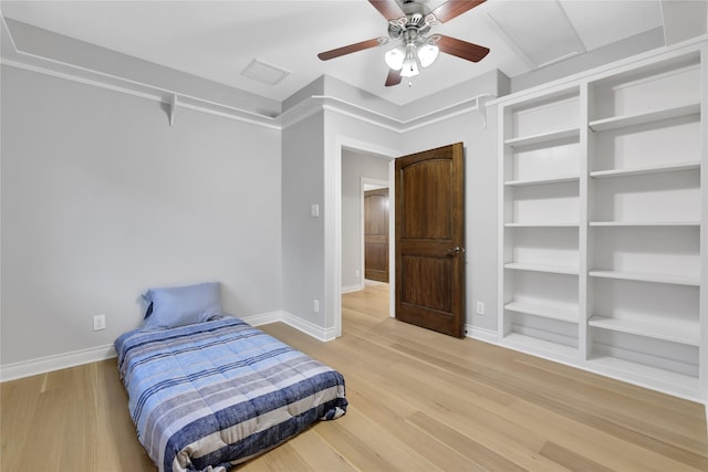 bedroom featuring ceiling fan and hardwood / wood-style flooring