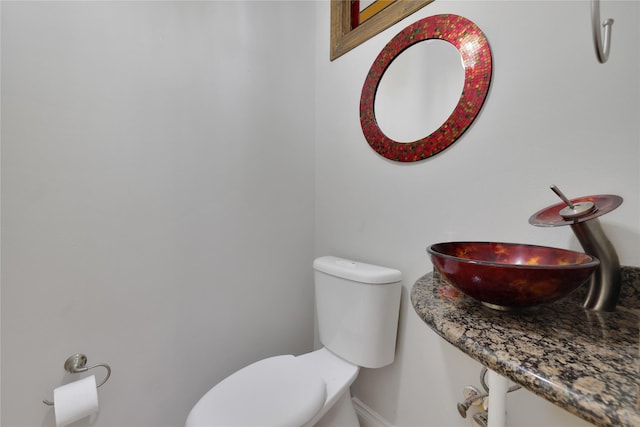 bathroom with toilet and sink