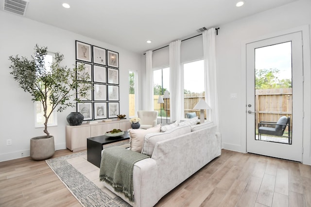 living room with light hardwood / wood-style floors