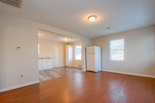 unfurnished room featuring hardwood / wood-style floors