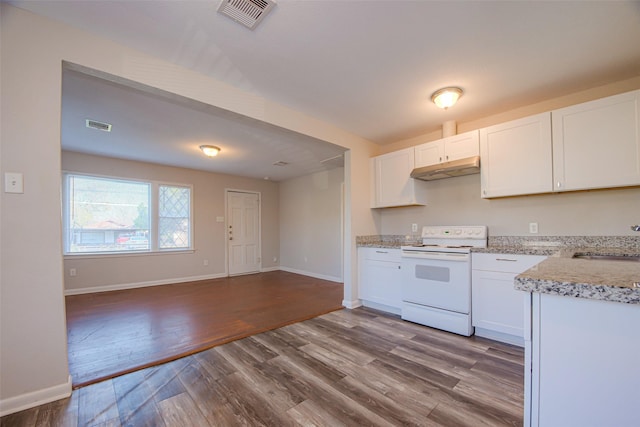 kitchen with white cabinets, hardwood / wood-style floors, sink, and electric stove