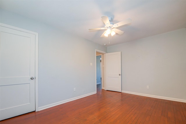 spare room featuring hardwood / wood-style flooring and ceiling fan