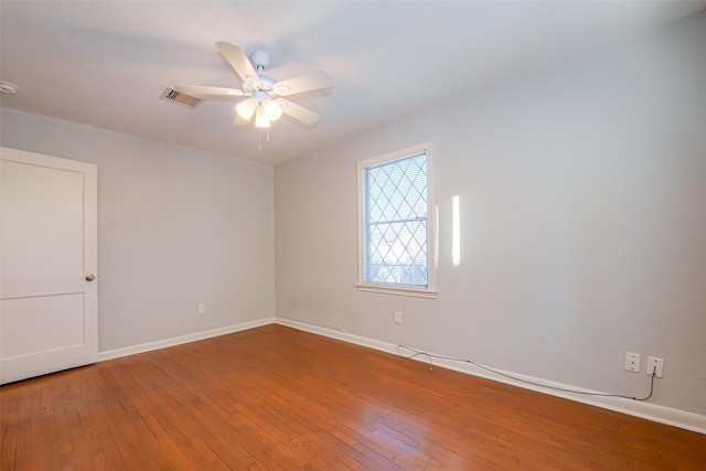 unfurnished room with wood-type flooring and ceiling fan