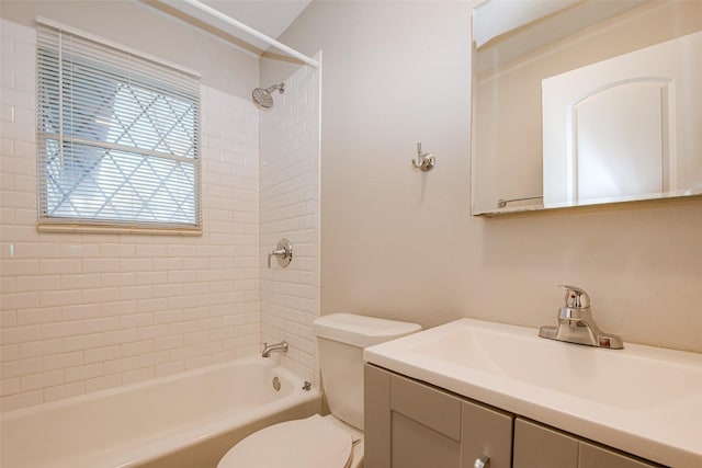 full bathroom featuring vanity, toilet, and tiled shower / bath