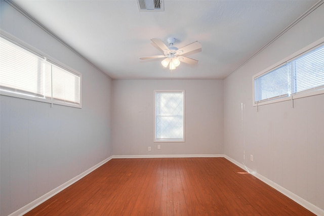 unfurnished room featuring hardwood / wood-style floors and ceiling fan