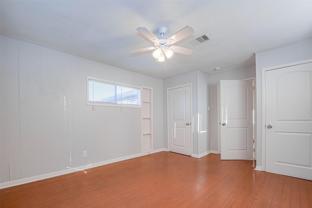 unfurnished bedroom featuring hardwood / wood-style flooring and ceiling fan