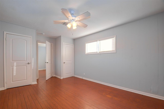 unfurnished bedroom featuring ceiling fan and wood-type flooring