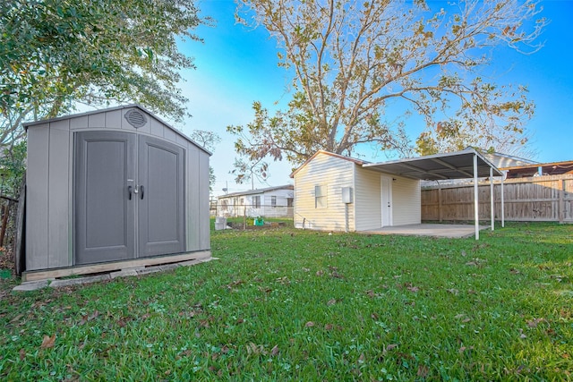 view of outdoor structure featuring a yard and a carport