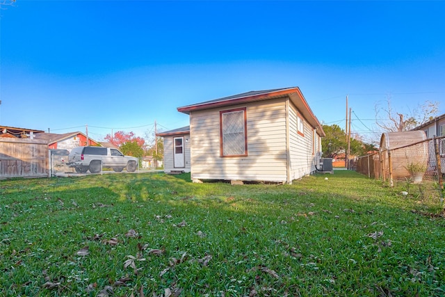 rear view of house with a yard