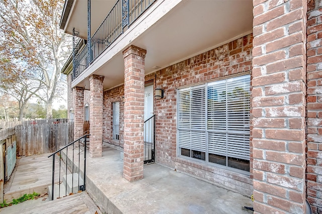 view of patio featuring a balcony