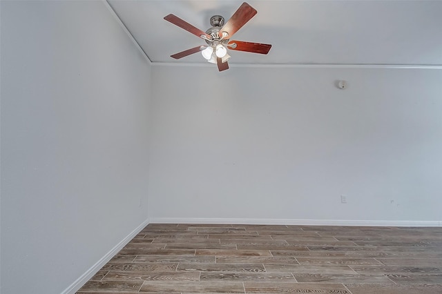 unfurnished room featuring ceiling fan, wood-type flooring, and ornamental molding