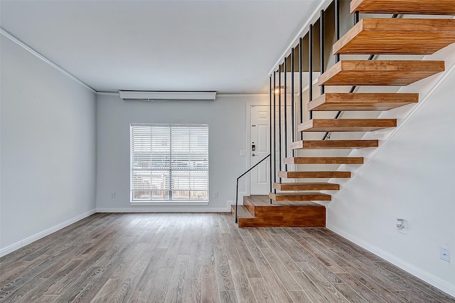 interior space with crown molding and hardwood / wood-style floors