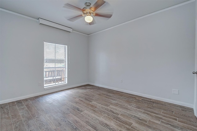 spare room with hardwood / wood-style flooring, ceiling fan, and ornamental molding