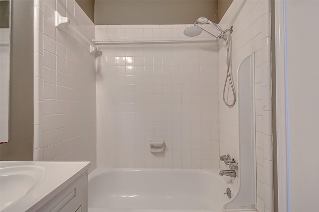 bathroom featuring vanity and tiled shower / bath combo