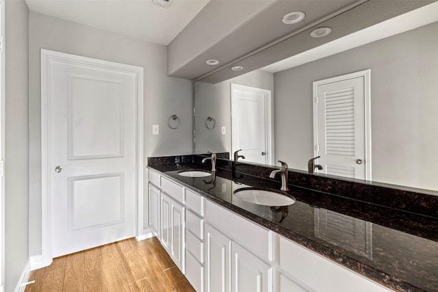 bathroom with wood-type flooring and vanity