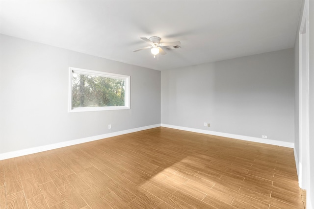 spare room featuring hardwood / wood-style flooring and ceiling fan