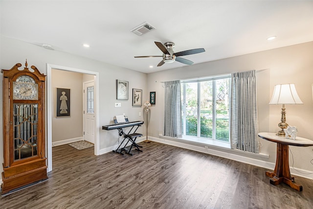 office space featuring dark hardwood / wood-style floors and ceiling fan