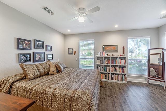 bedroom with ceiling fan and dark wood-type flooring