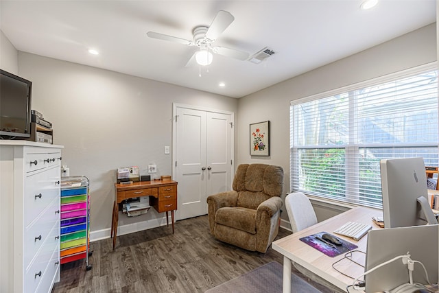 office space featuring ceiling fan and dark hardwood / wood-style floors