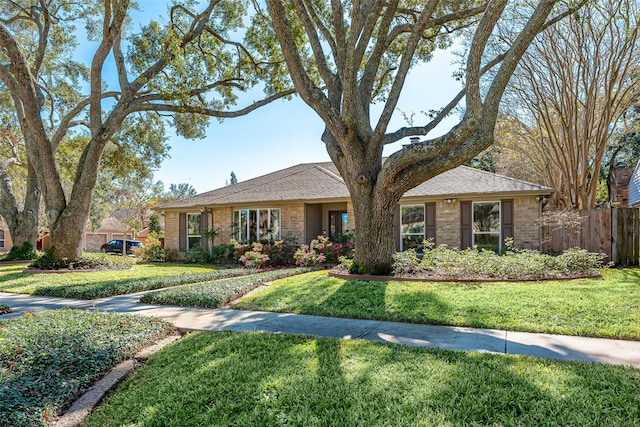 ranch-style house with a front lawn