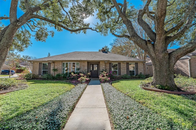 single story home with a front yard