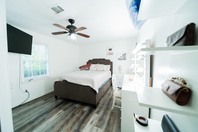 bedroom with dark hardwood / wood-style floors and ceiling fan