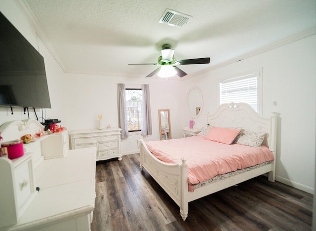 bedroom with a textured ceiling, dark hardwood / wood-style floors, ceiling fan, and ornamental molding