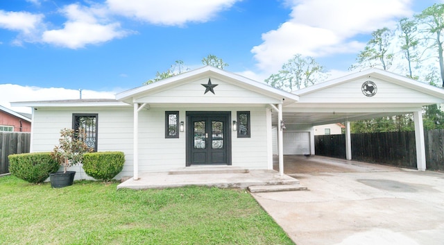 ranch-style home with a carport, a porch, and a front yard