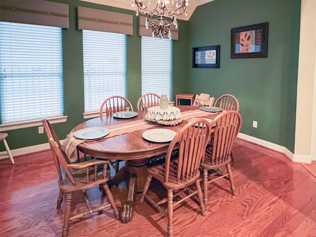 dining area featuring an inviting chandelier and a wall mounted AC